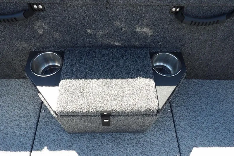 Slide: The Image of 2026 Lund 1875 Pro-V Bass XS boat interior with cup holders and storage compartment. - 21