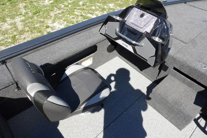 Slide: The Image of 2026 Lund 1875 Pro-V Bass XS interior with seat and console, showcasing modern design. - 27