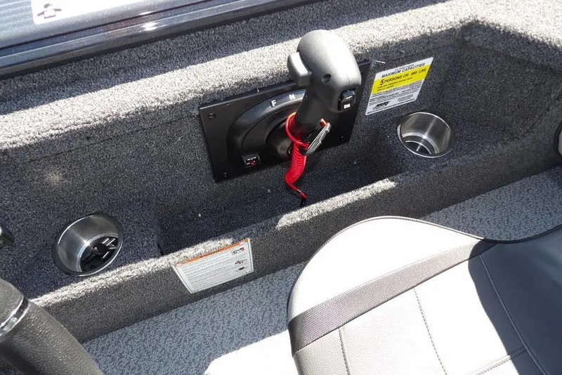 Slide: The Image of Interior of 2026 Lund 1875 Pro-V Bass XS boat with control panel and cup holders. - 29