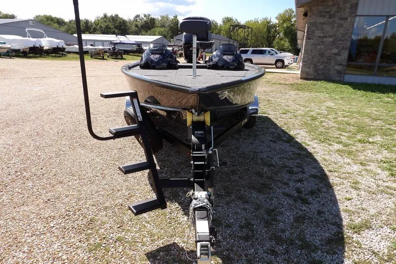 Slide: The Image of 2026 Lund 1875 Pro-V Bass XS boat on trailer, parked outdoors. - 3