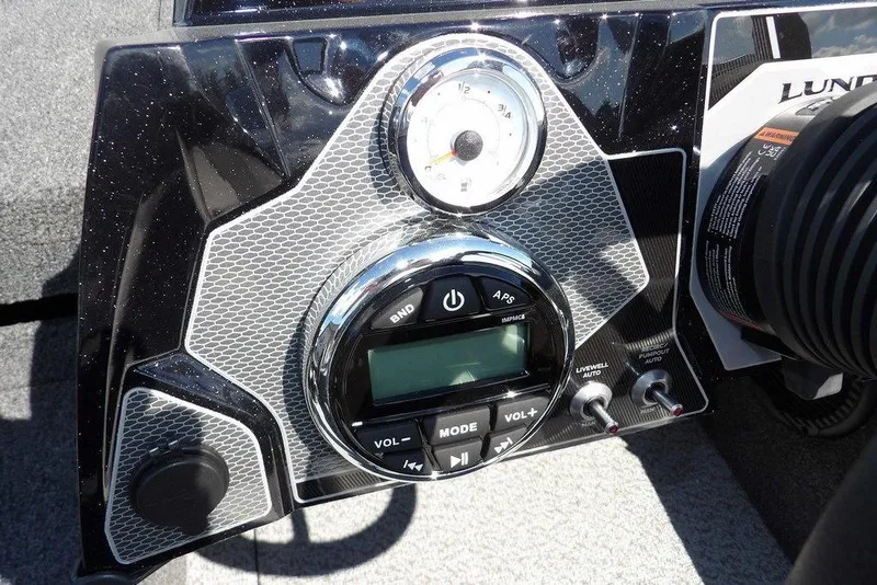 Slide: The Image of Dashboard of 2026 Lund 1875 Pro-V Bass XS boat with control panel and gauges. - 31