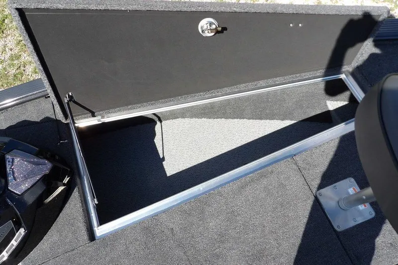 Slide: The Image of Open storage compartment on 2026 Lund 1875 Pro-V Bass XS boat. - 44