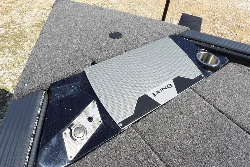 Slide: The Image of 2026 Lund 1875 Pro-V Bass XS boat deck with storage and cup holder. - 46