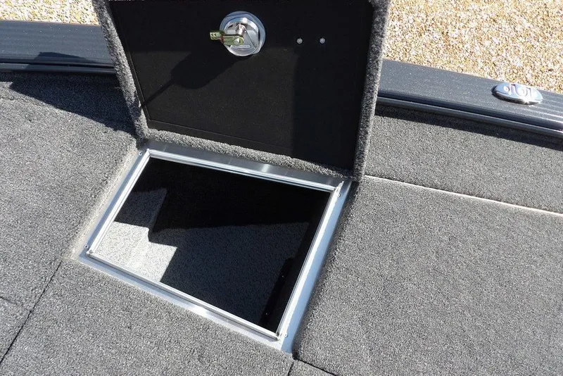 Slide: The Image of Open storage compartment on 2026 Lund 1875 Pro-V Bass XS boat deck. - 47
