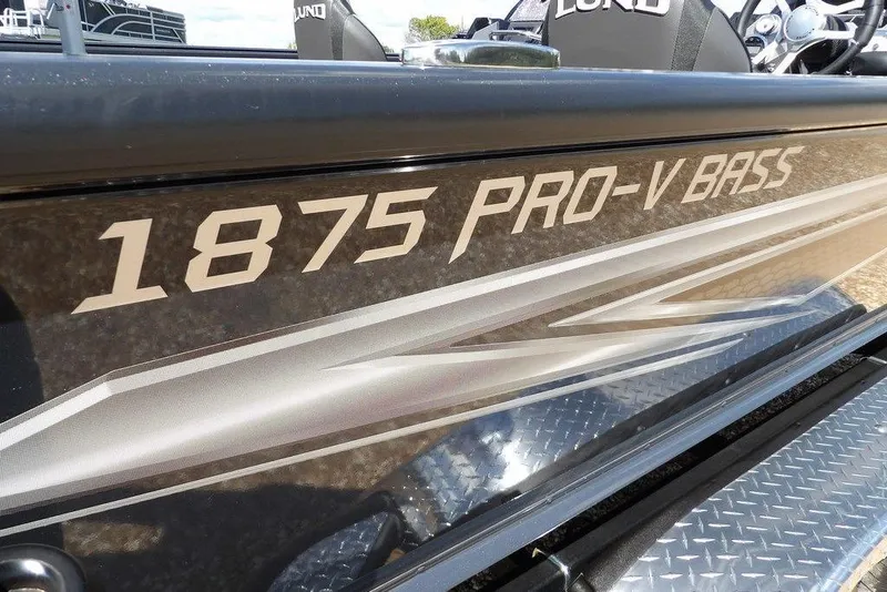 Slide: The Image of 2026 Lund 1875 Pro-V Bass XS boat with sleek design and bold lettering. - 49