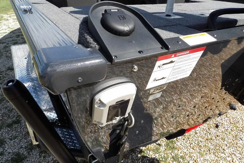 Slide: The Image of 2026 Lund 1875 Pro-V Bass XS boat rear view with safety labels and equipment. - 55