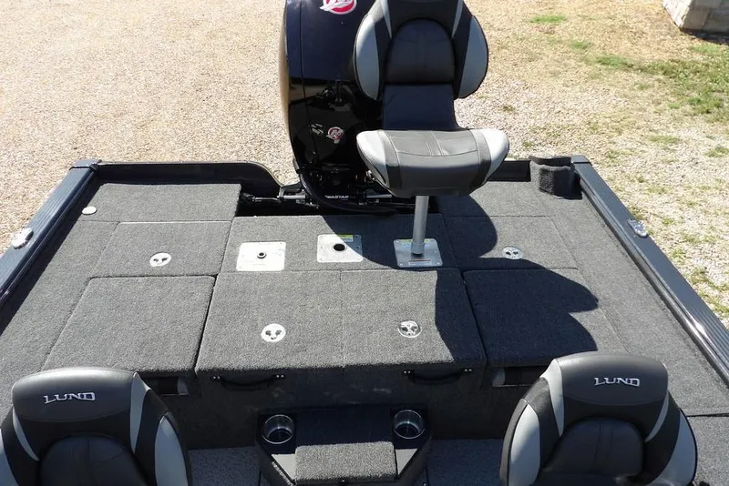 Slide: The Image of 2026 Lund 1875 Pro-V Bass XS boat interior with seating and storage compartments. - 7