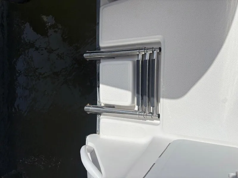 Slide: The Image of Stainless steel boat ladder on 2015 Everglades 245 CX, folded on white deck. - 18