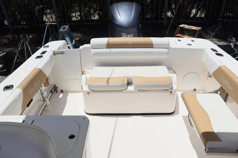 Slide: The Image of 2015 Everglades 245 CX boat interior with beige and white seating. - 8
