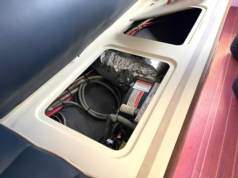 Slide: The Image of Open compartment in 2008 Goetz Custom Boats 33' Limo Tender showing wiring and components. - 11