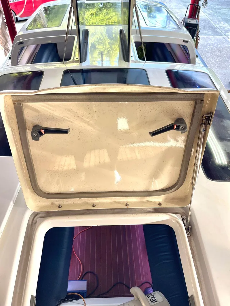 Slide: The Image of 2008 Goetz Custom Boats 33' Limo Tender interior with open hatch and seating area. - 12