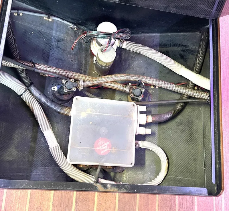 Slide: The Image of Engine compartment of a 2008 Goetz Custom Boats 33' Limo Tender, showing hoses and wiring. - 13