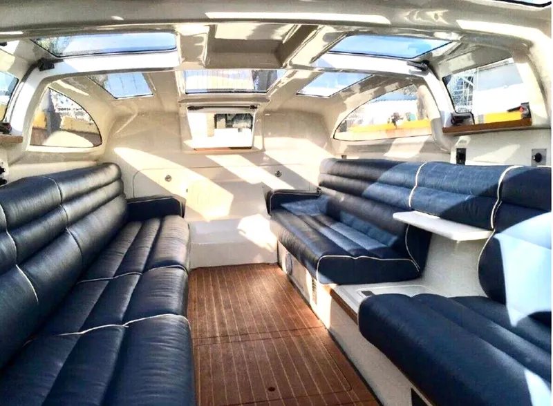 Slide: The Image of Luxurious interior of 2008 Goetz Custom Boats 33' Limo Tender with plush seating and skylights. - 2