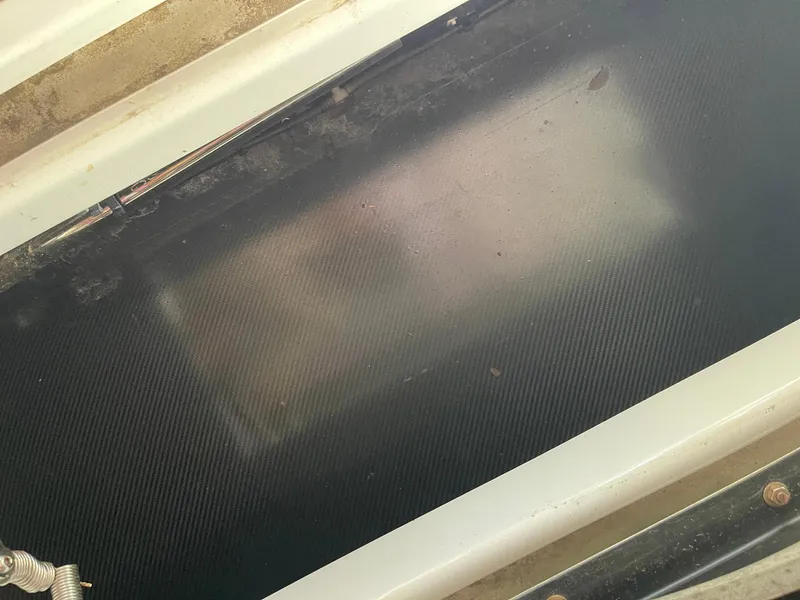 Slide: The Image of Interior view of a 2008 Goetz Custom Boats 33' Limo Tender, showcasing carbon fiber detailing. - 9