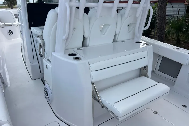 Slide: The Image of 2026 Sportsman Open 352 Center Console boat with white seating and modern design. - 11