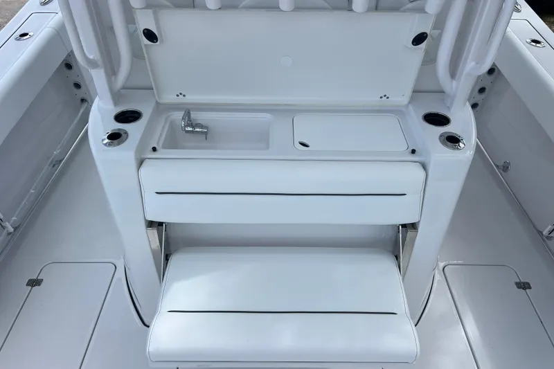 Slide: The Image of 2026 Sportsman Open 352 Center Console interior with sink and seating area. - 12