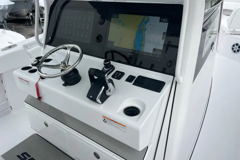 Slide: The Image of 2026 Sportsman Open 352 Center Console dashboard with steering wheel and navigation display. - 16