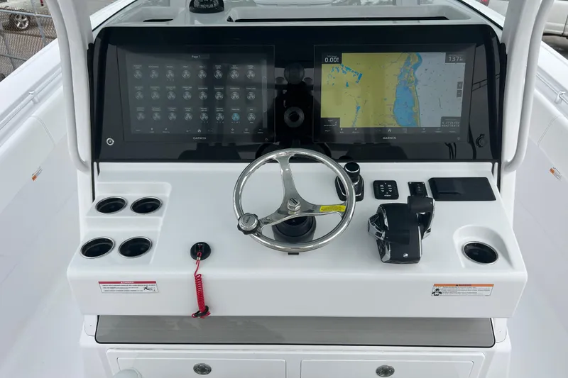 Slide: The Image of 2026 Sportsman Open 352 Center Console dashboard with steering wheel and navigation display. - 17
