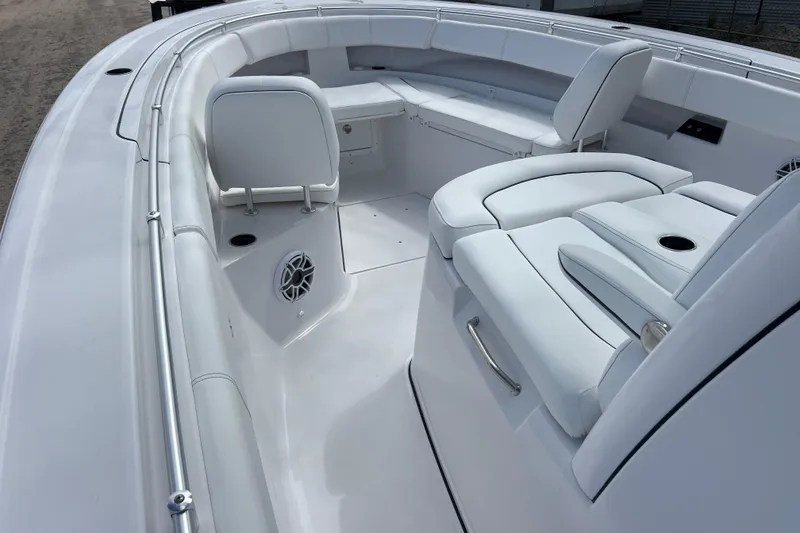 Slide: The Image of 2026 Sportsman Open 352 Center Console boat interior with white seating and modern design. - 20