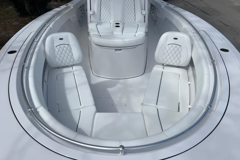 Slide: The Image of 2026 Sportsman Open 352 Center Console boat with luxurious white seating and sleek design. - 21