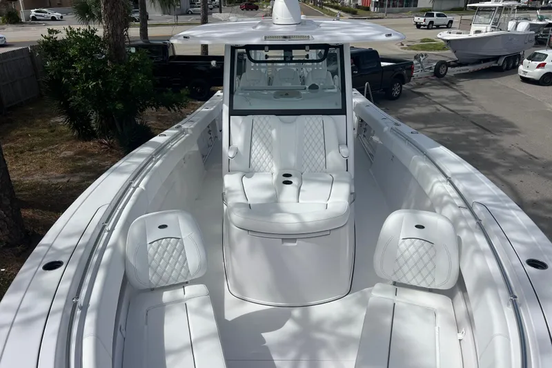 Slide: The Image of 2026 Sportsman Open 352 Center Console boat with luxurious white seating. - 22