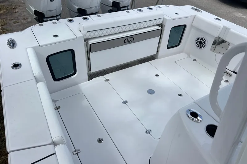 Slide: The Image of 2026 Sportsman Open 352 Center Console boat interior with white deck and seating. - 27