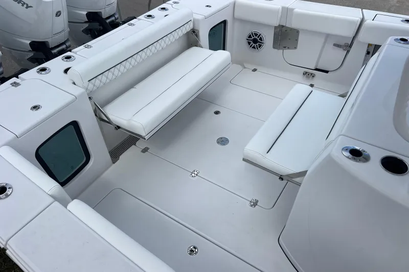 Slide: The Image of 2026 Sportsman Open 352 Center Console boat interior with white seating and modern design. - 29