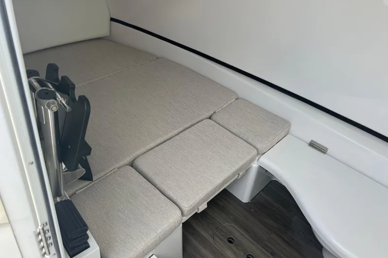 Slide: The Image of 2026 Sportsman Open 352 Center Console cabin interior with cushioned seating and modern design. - 31