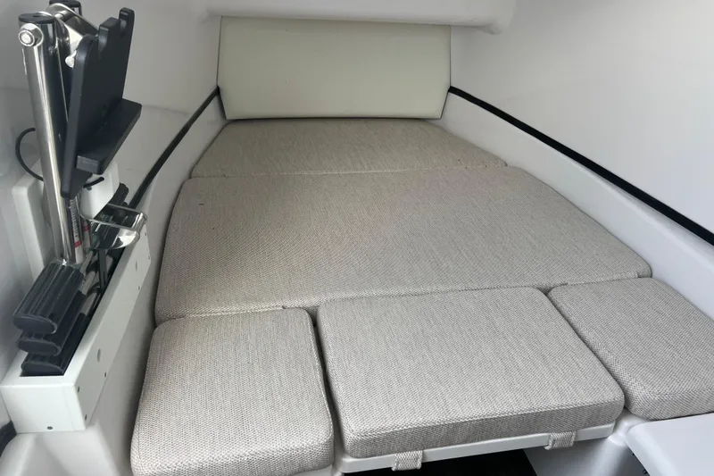 Slide: The Image of 2026 Sportsman Open 352 Center Console cabin with cushioned seating and modern interior design. - 32