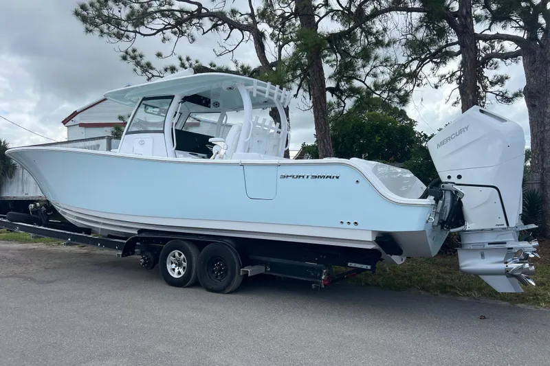 Slide: The Image of 2026 Sportsman Open 352 Center Console boat on trailer, parked outdoors. - 4