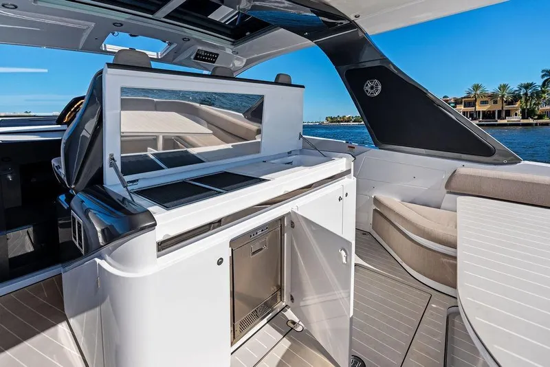 Slide: The Image of 2024 Azimut Verve 42 yacht interior with sleek kitchen and seating area. - 25