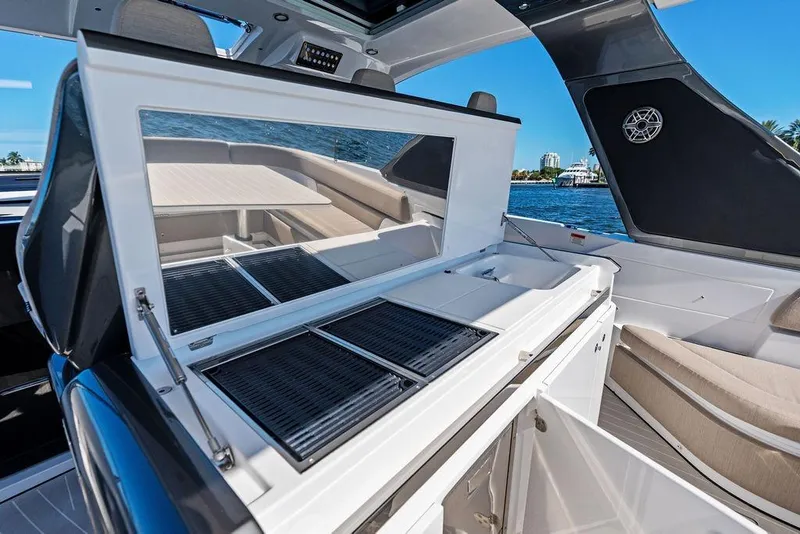 Slide: The Image of 2024 Azimut Verve 42 yacht interior with open kitchenette and seating area. - 26