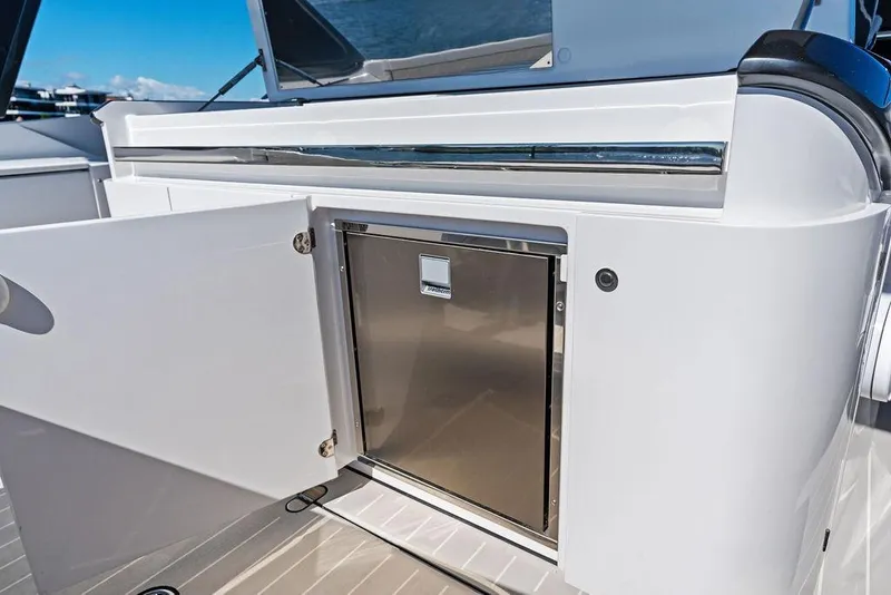 Slide: The Image of 2024 Azimut Verve 42 yacht with open storage compartment and stainless steel door. - 27