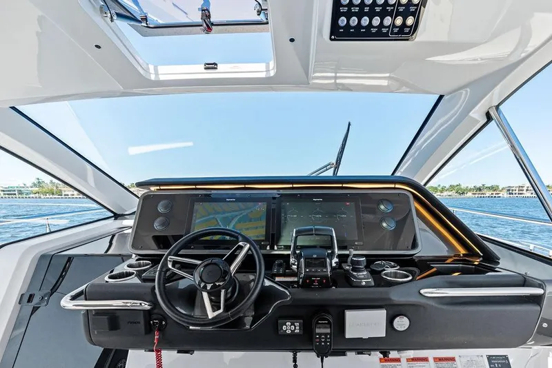 Slide: The Image of 2024 Azimut Verve 42 yacht helm with modern navigation displays and steering wheel. - 28