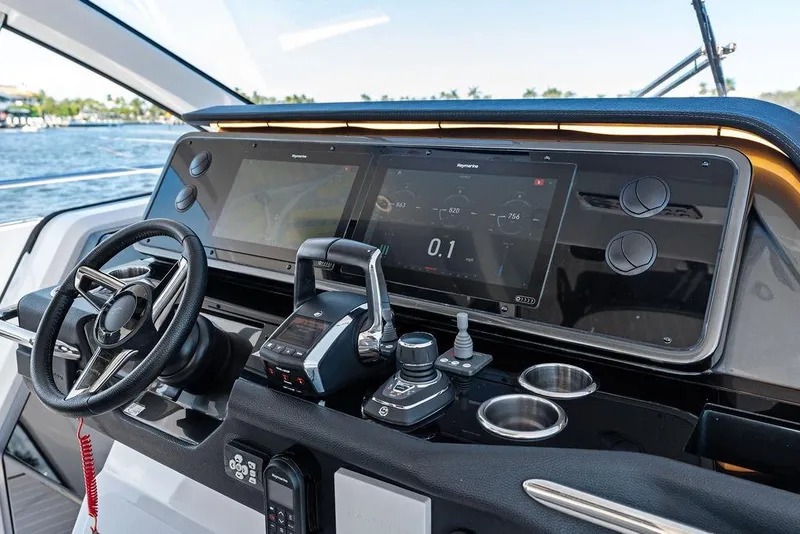 Slide: The Image of 2024 Azimut Verve 42 helm with advanced navigation displays and controls. - 29