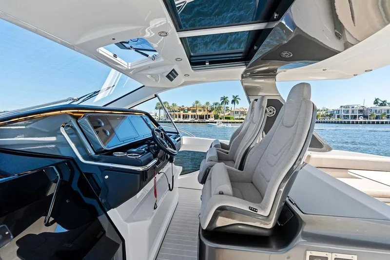 Slide: The Image of 2024 Azimut Verve 42 yacht cockpit with modern helm and luxurious seating. - 31