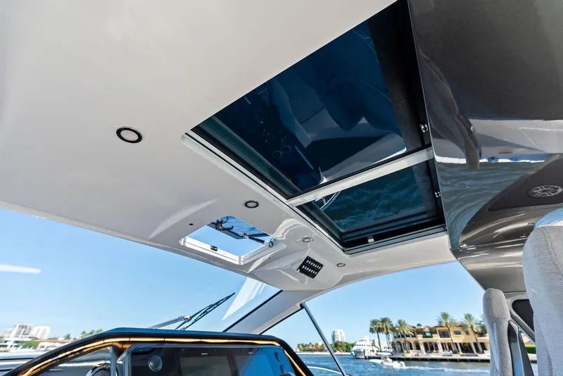 Slide: The Image of 2024 Azimut Verve 42 yacht interior with sunroof, showcasing luxury design and waterfront view. - 32
