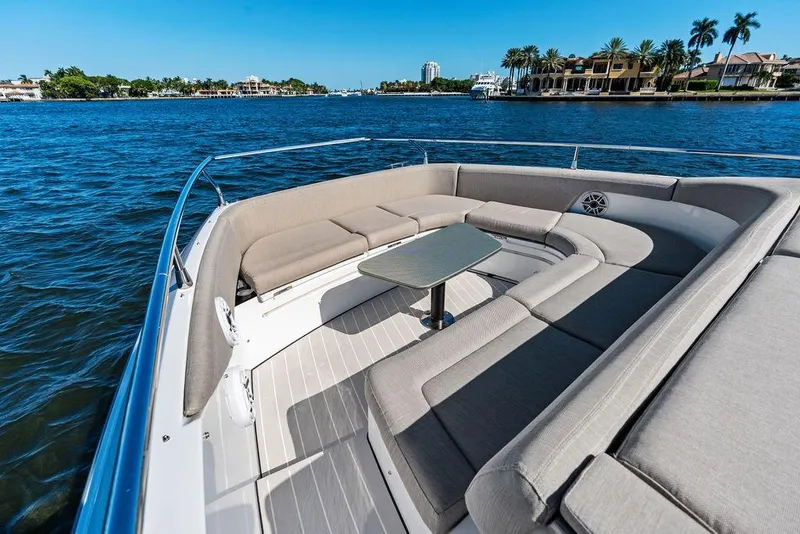 Slide: The Image of 2024 Azimut Verve 42 yacht with luxurious seating, cruising on a scenic waterfront. - 35