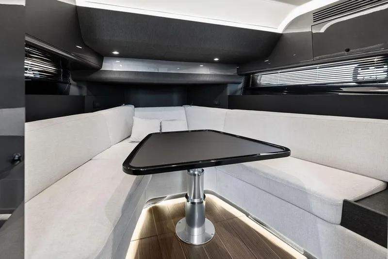 Slide: The Image of Luxurious interior of 2024 Azimut Verve 42 yacht with sleek seating and modern table design. - 43