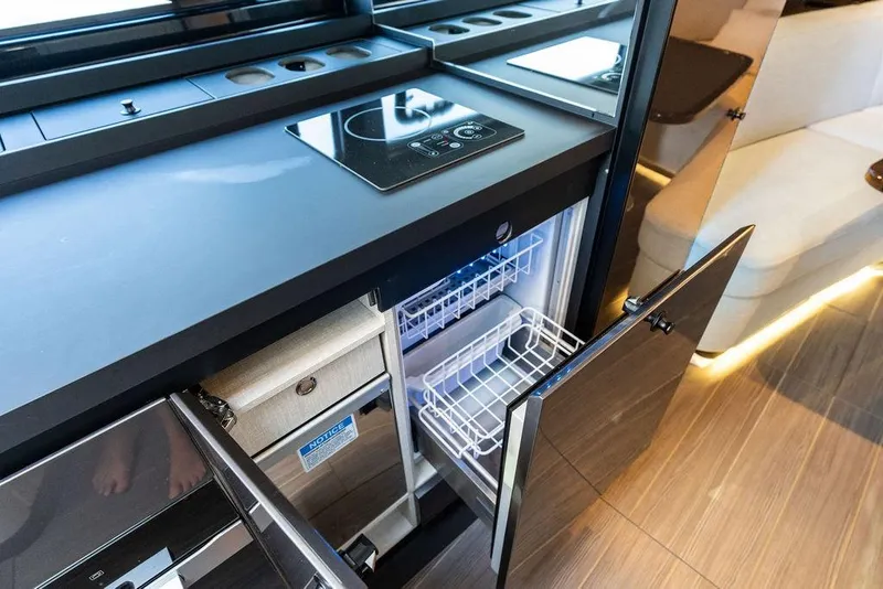 Slide: The Image of Modern kitchen area in 2024 Azimut Verve 42 yacht with sleek appliances and cabinetry. - 44