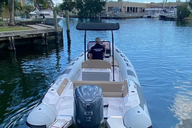 Slide: The Image of 2026 Ranieri CAYMAN 23 Sport boat on a calm waterway, rear view. - 7