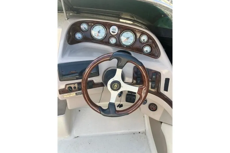 Slide: The Image of Steering wheel and dashboard of 2001 Regal 2550 LSC boat. - 2