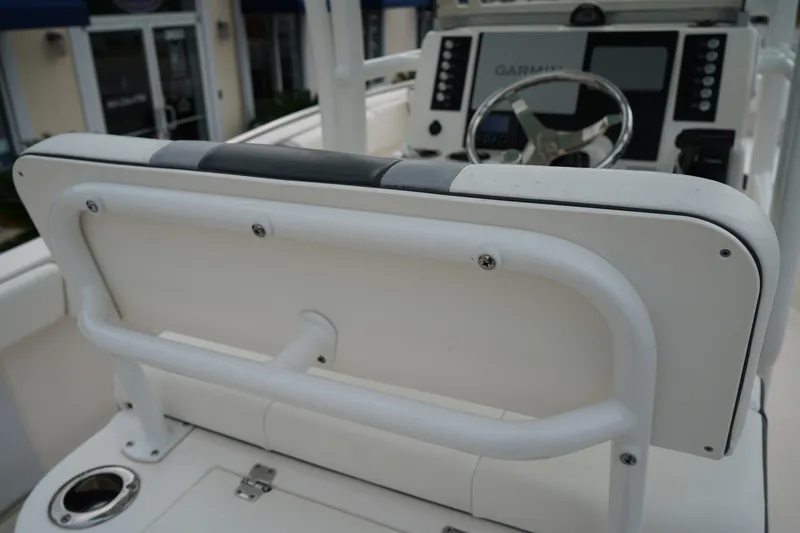 Slide: The Image of 2023 Robalo R222 Center Console helm with Garmin navigation system and steering wheel. - 10