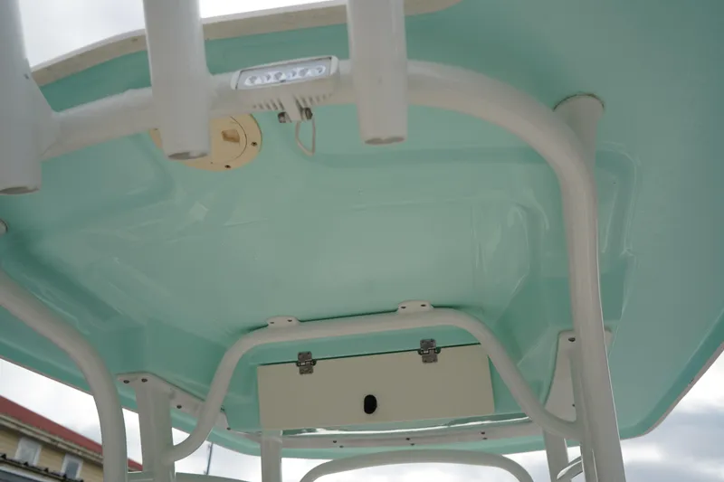 Slide: The Image of 2023 Robalo R222 Center Console boat's T-top structure, featuring a light blue finish. - 12