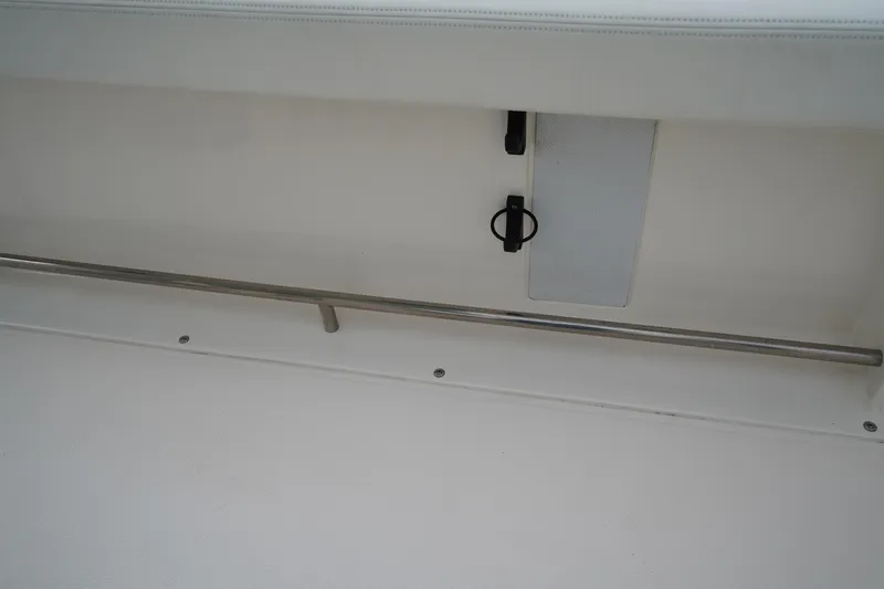 Slide: The Image of 2023 Robalo R222 Center Console interior detail with stainless steel railing. - 13