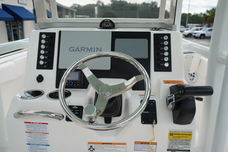 Slide: The Image of 2023 Robalo R222 Center Console helm with Garmin display and controls. - 16