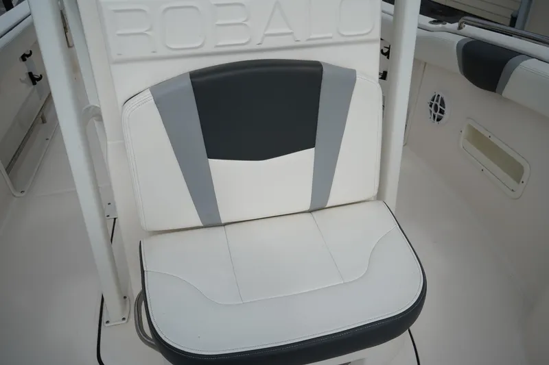 Slide: The Image of 2023 Robalo R222 Center Console boat seat with stylish white and gray upholstery. - 18
