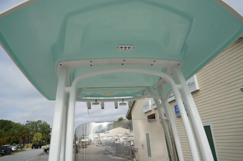 Slide: The Image of 2023 Robalo R222 Center Console boat's T-top structure, viewed from below. - 20