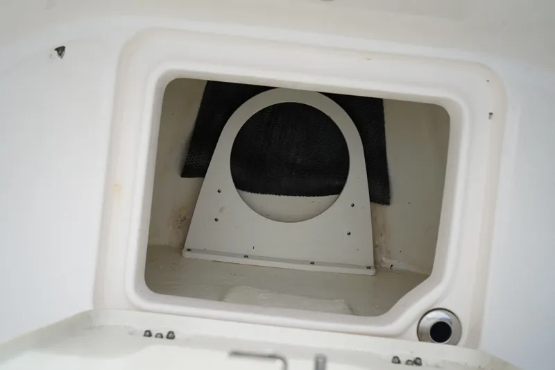 Slide: The Image of 2023 Robalo R222 Center Console storage compartment interior view. - 28