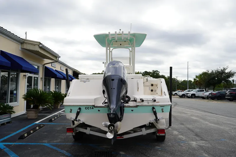 Slide: The Image of 2023 Robalo R222 Center Console boat on trailer, parked outside dealership. - 5